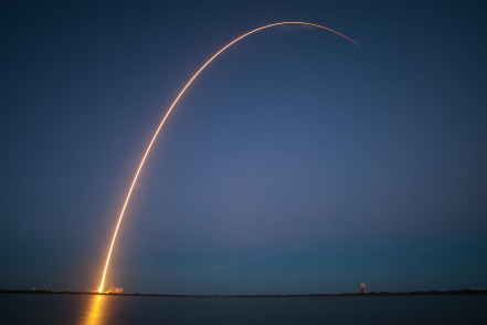 rocket launch night trajectory reusable spacecraft